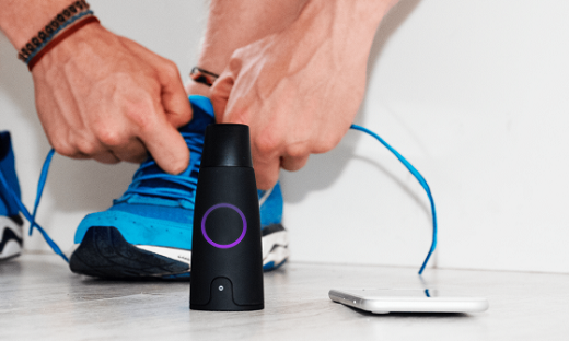 Man ties shoes next to Lumen device